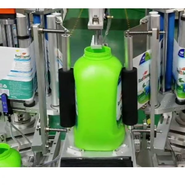 Semi automatic labelling machine for two labels at the back and front of the containers olive oil detergents shoe paints car oils shampoo shower gel bath