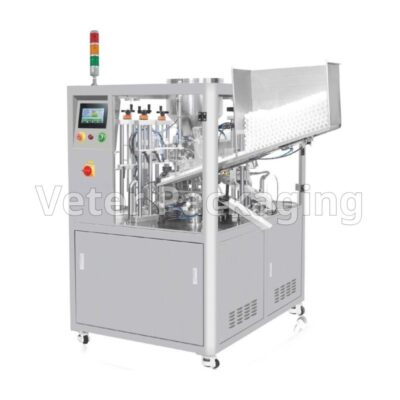 Tube filling and sealing packaging machines